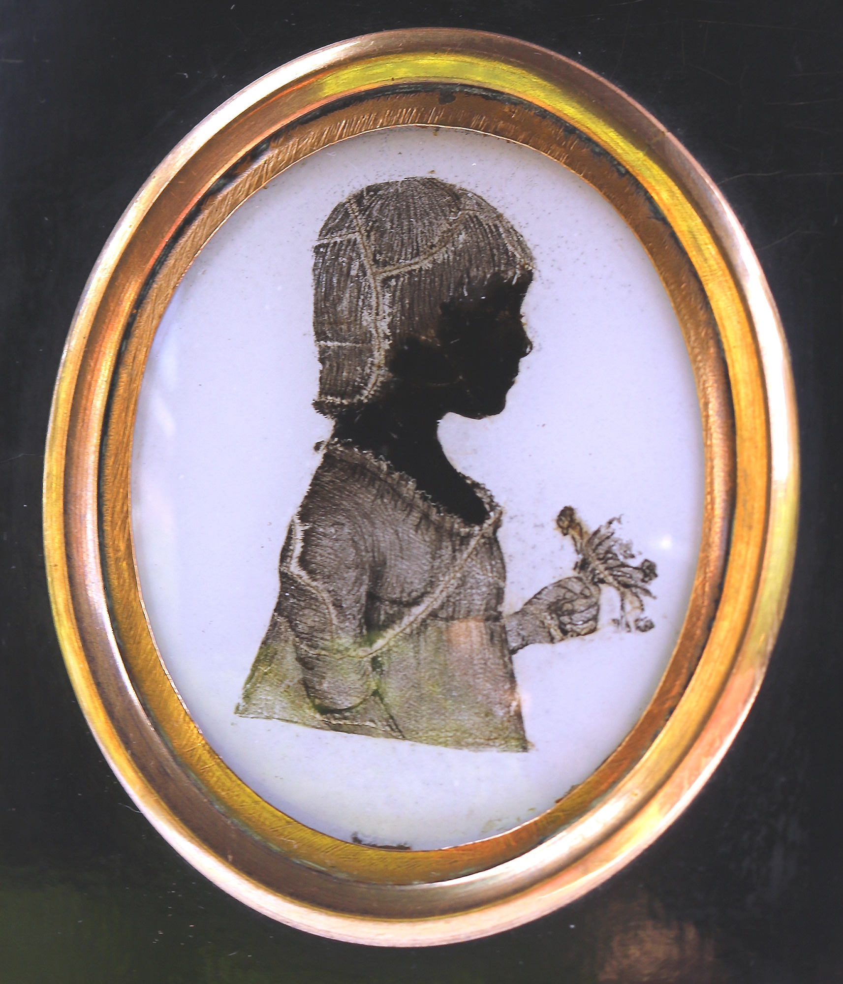 An unusual antique reverse painted on glass Portrait Miniature Silhouette C.19thC
