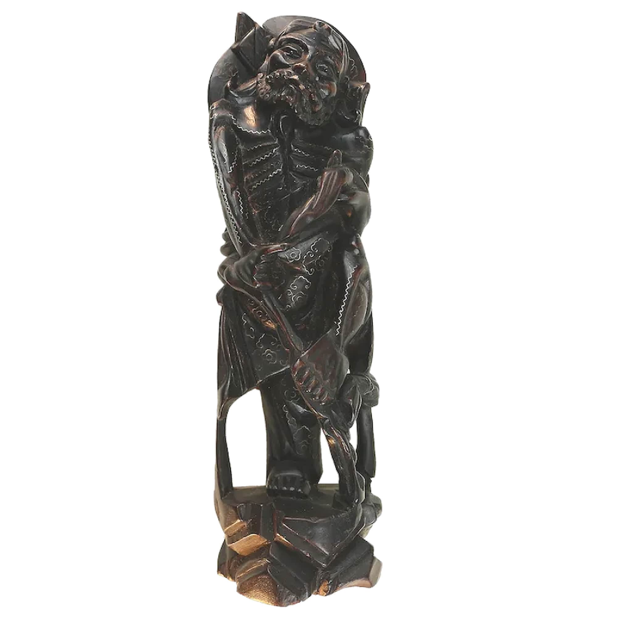 A large antique Chinese silver inlaid hardwood carved Warrior Figurine C.19thC