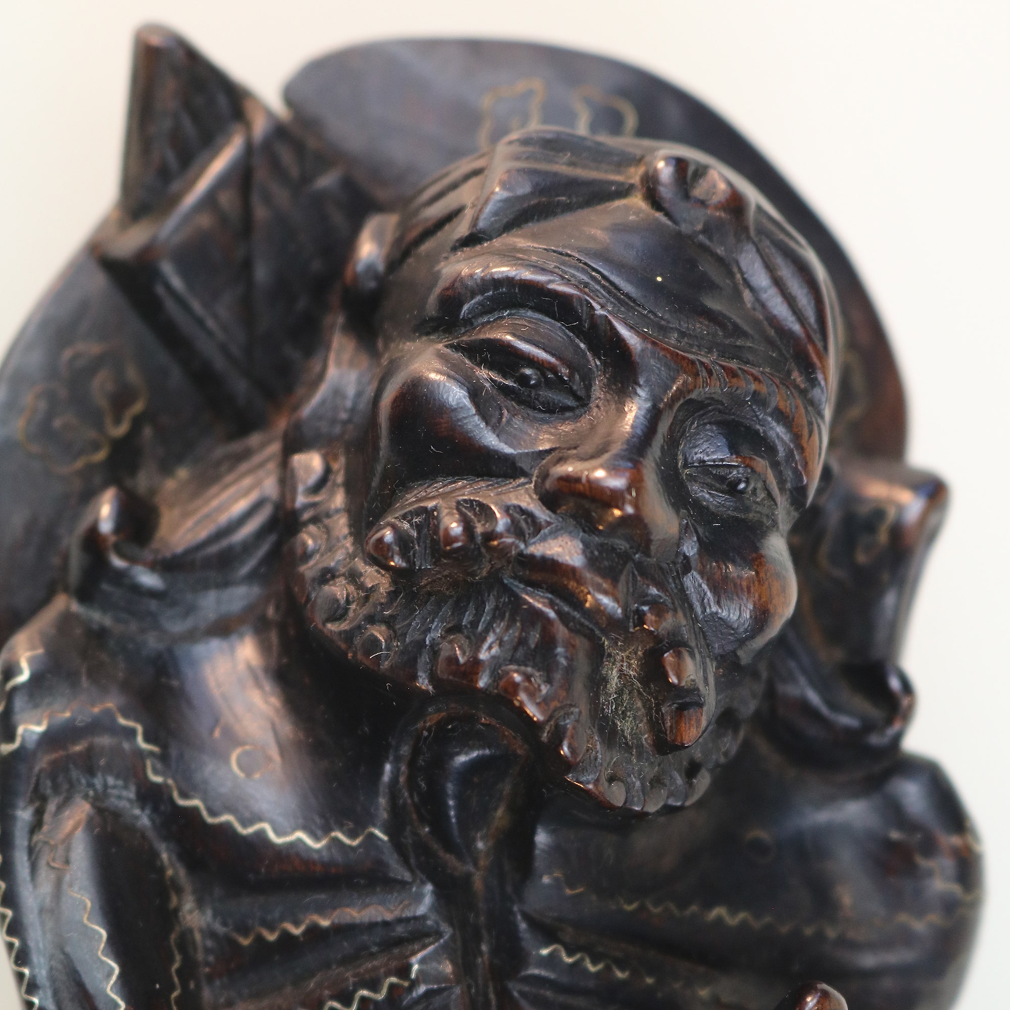 A large antique Chinese silver inlaid hardwood carved Warrior Figurine C.19thC