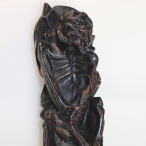 A large antique Chinese silver inlaid hardwood carved Warrior Figurine C.19thC