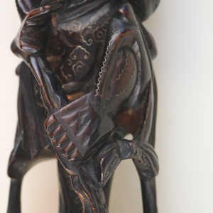 A large antique Chinese silver inlaid hardwood carved Warrior Figurine C.19thC