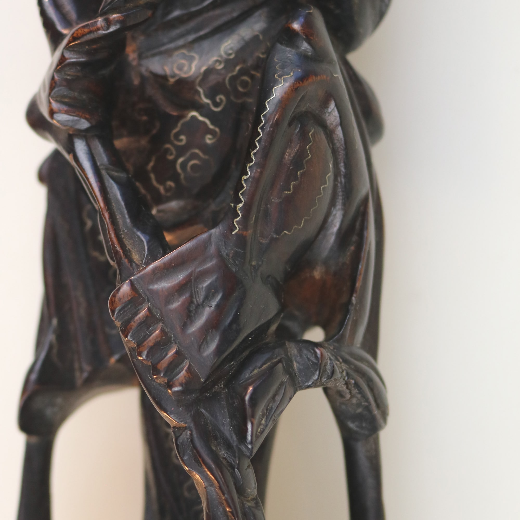 A large antique Chinese silver inlaid hardwood carved Warrior Figurine C.19thC