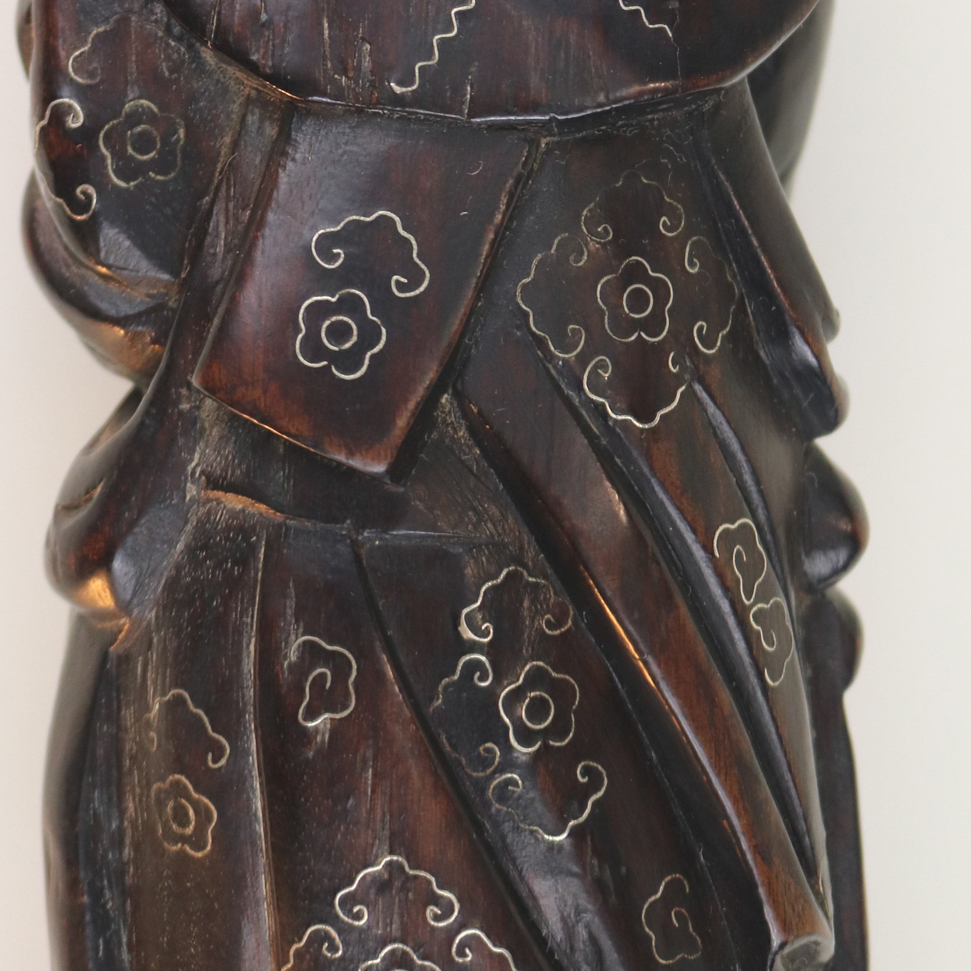 A large antique Chinese silver inlaid hardwood carved Warrior Figurine C.19thC