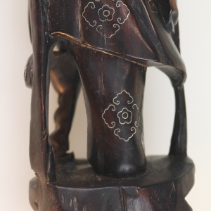 A large antique Chinese silver inlaid hardwood carved Warrior Figurine C.19thC
