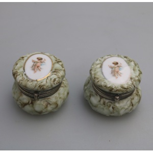 A pair of antique porcelain Continental cherub lidded Jars / Boxes C.19thC