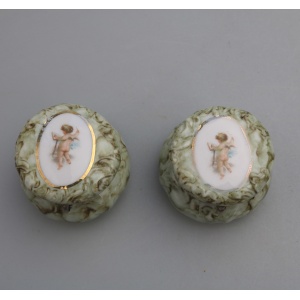 A pair of antique porcelain Continental cherub lidded Jars / Boxes C.19thC
