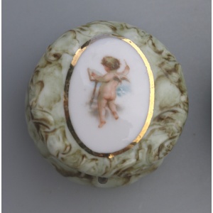 A pair of antique porcelain Continental cherub lidded Jars / Boxes C.19thC
