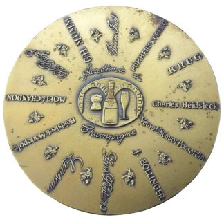 A bronze Advertiser for Champagne Academy Commemorative Disc Paperweight C.1982
