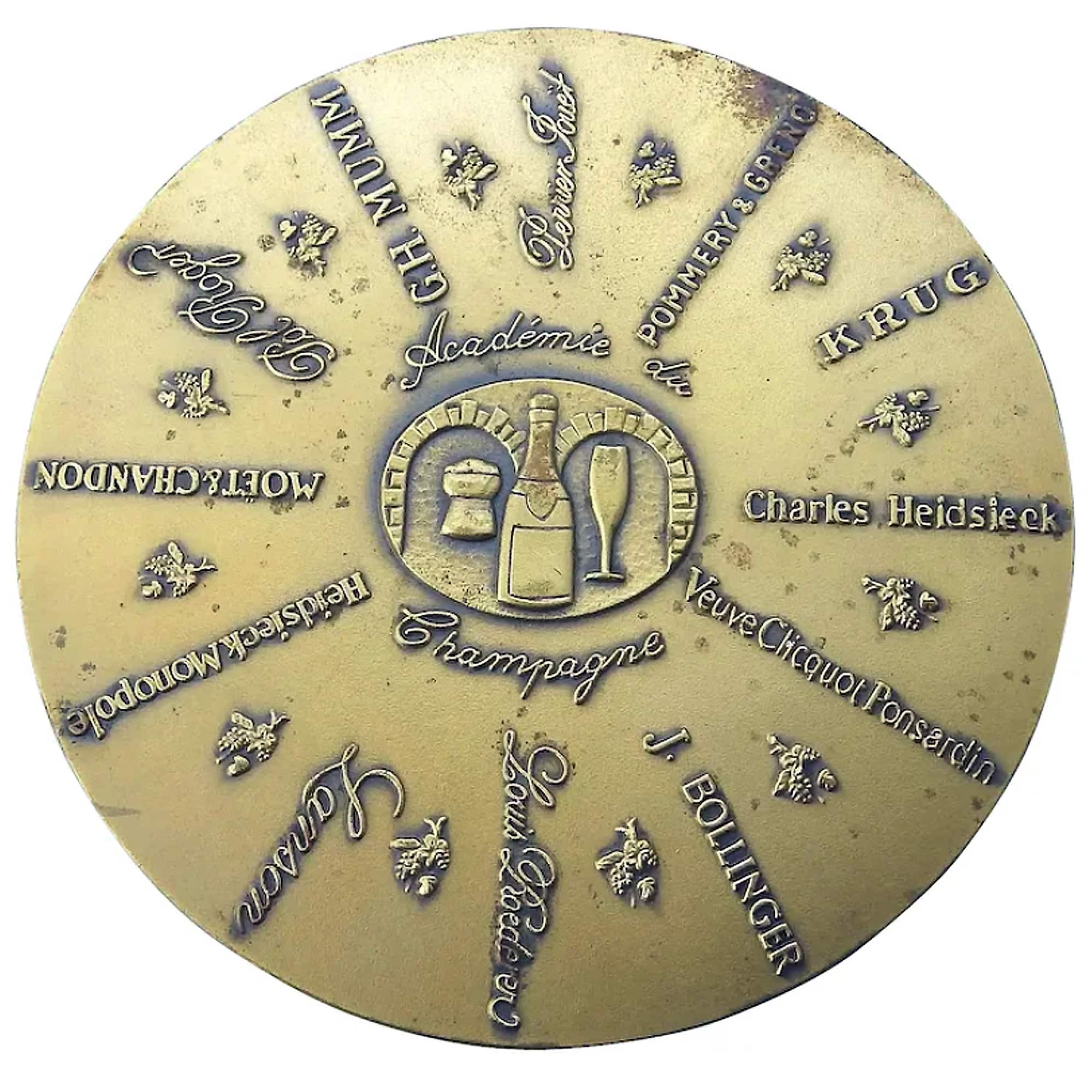 A bronze Advertiser for Champagne Academy Commemorative Disc Paperweight C.1982
