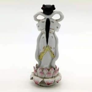 An antique Chinese porcelain Figure of girl stood on a lotus flower C.1900+