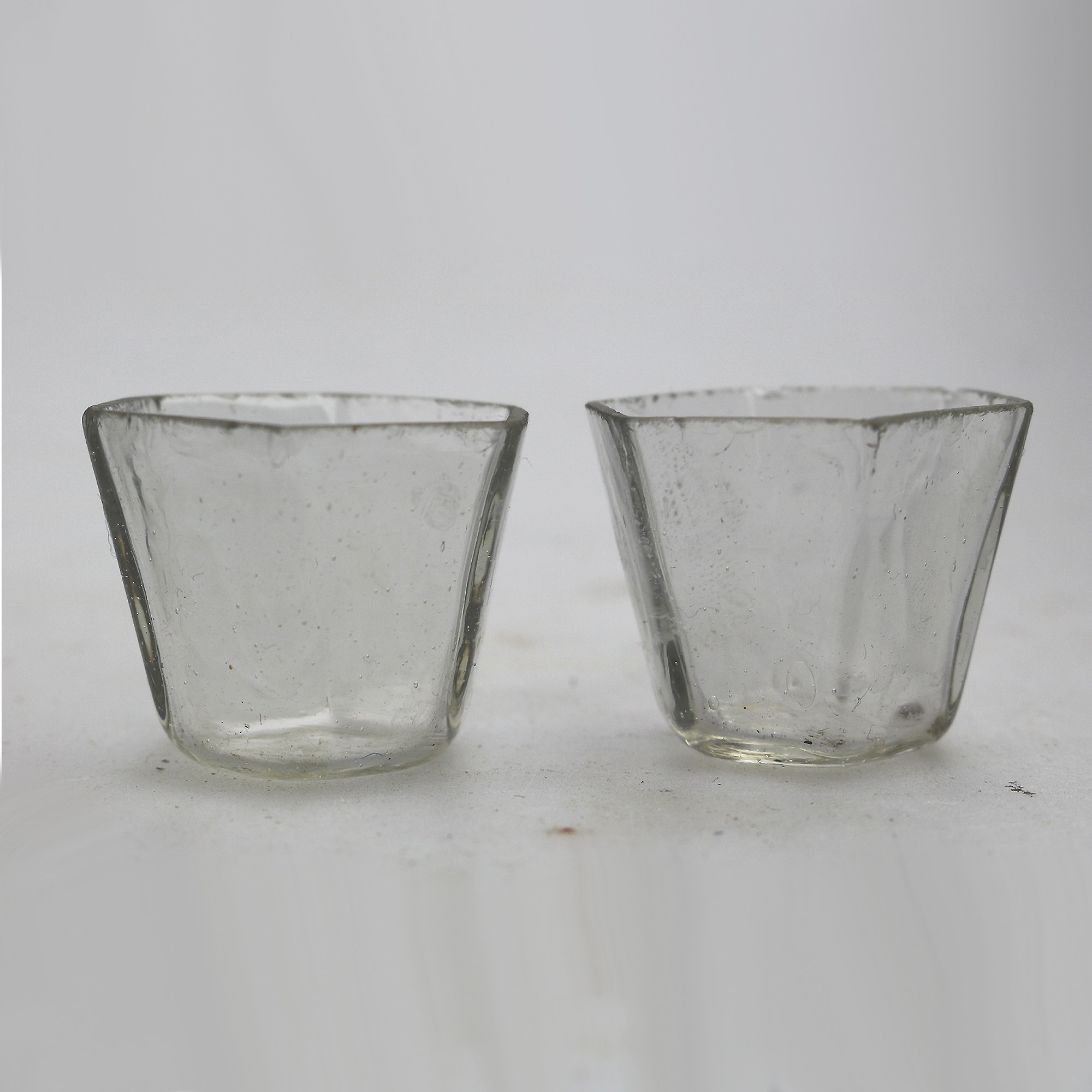 A good pair antique Chinese solid silver novelty Wang Hing Salts & liners C.1900