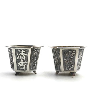 A good pair antique Chinese solid silver novelty Wang Hing Salts & liners C.1900