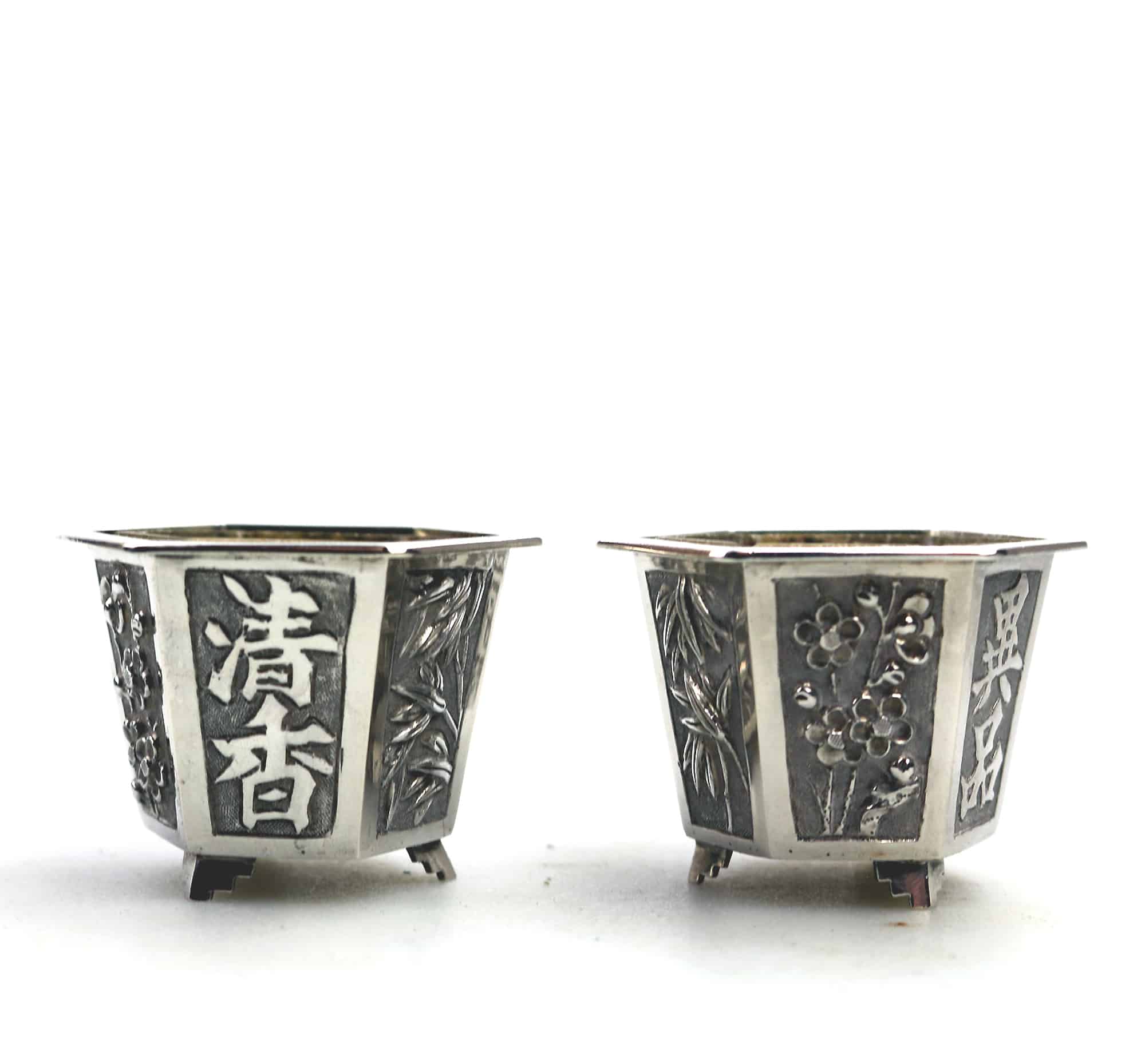 A good pair antique Chinese solid silver novelty Wang Hing Salts & liners C.1900