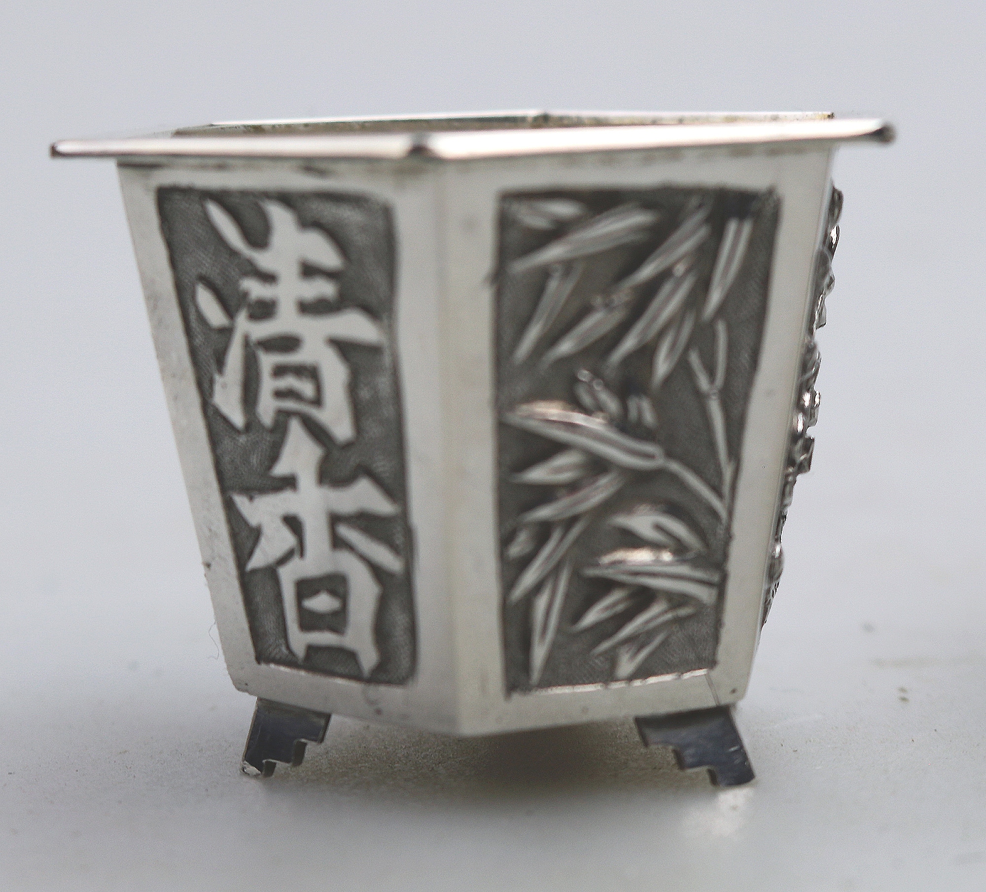 A good pair antique Chinese solid silver novelty Wang Hing Salts & liners C.1900