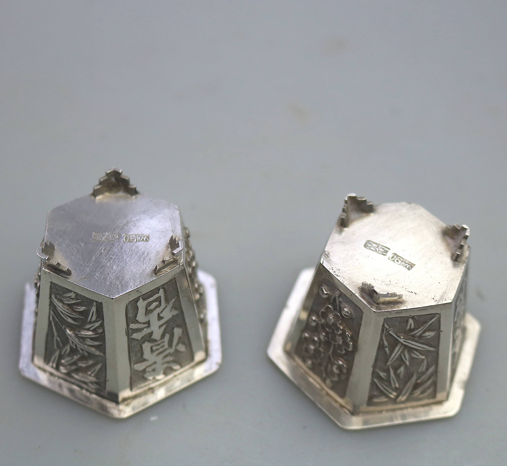 A good pair antique Chinese solid silver novelty Wang Hing Salts & liners C.1900