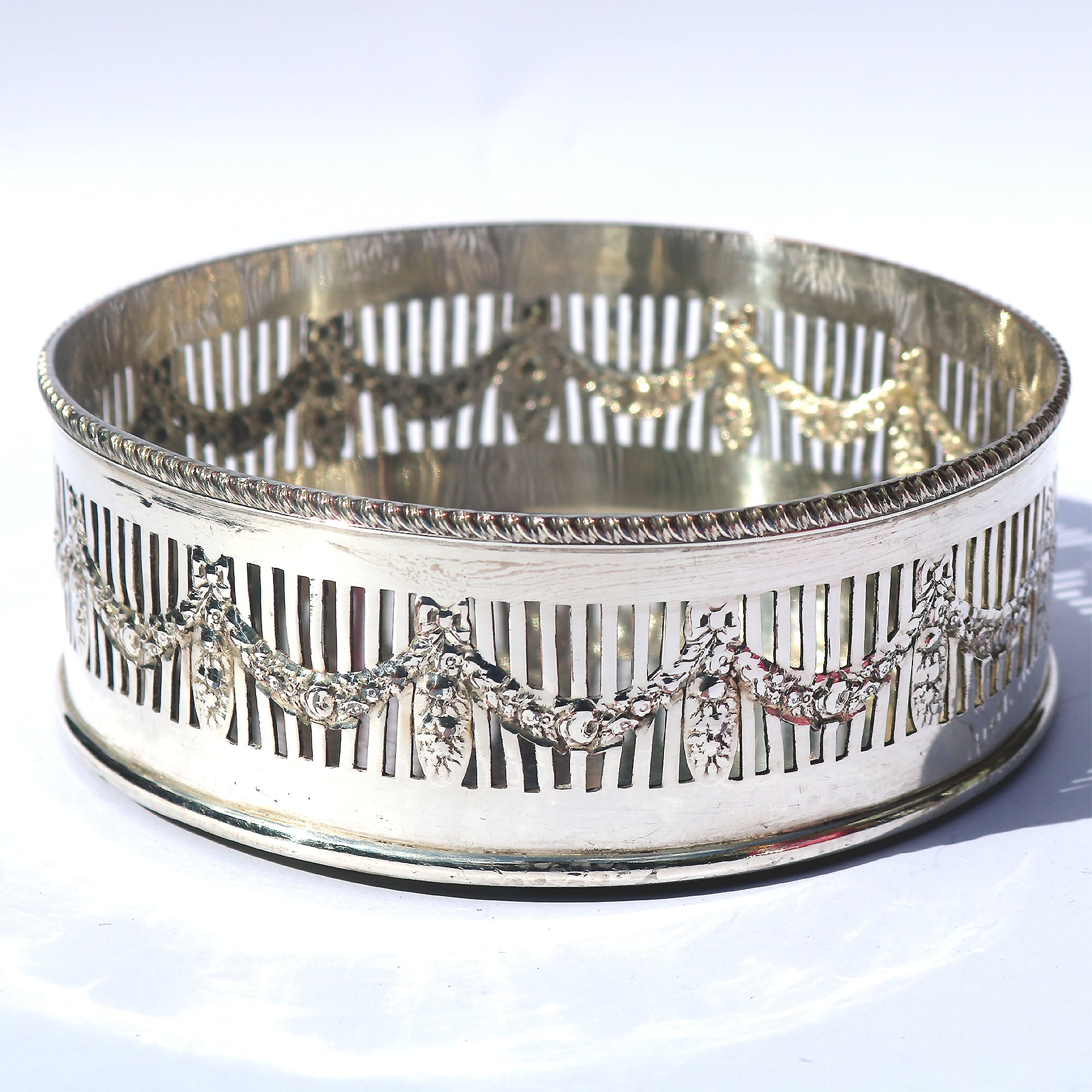 An antique silver plated on copper pierced Decanter Stand Coaster C.1900