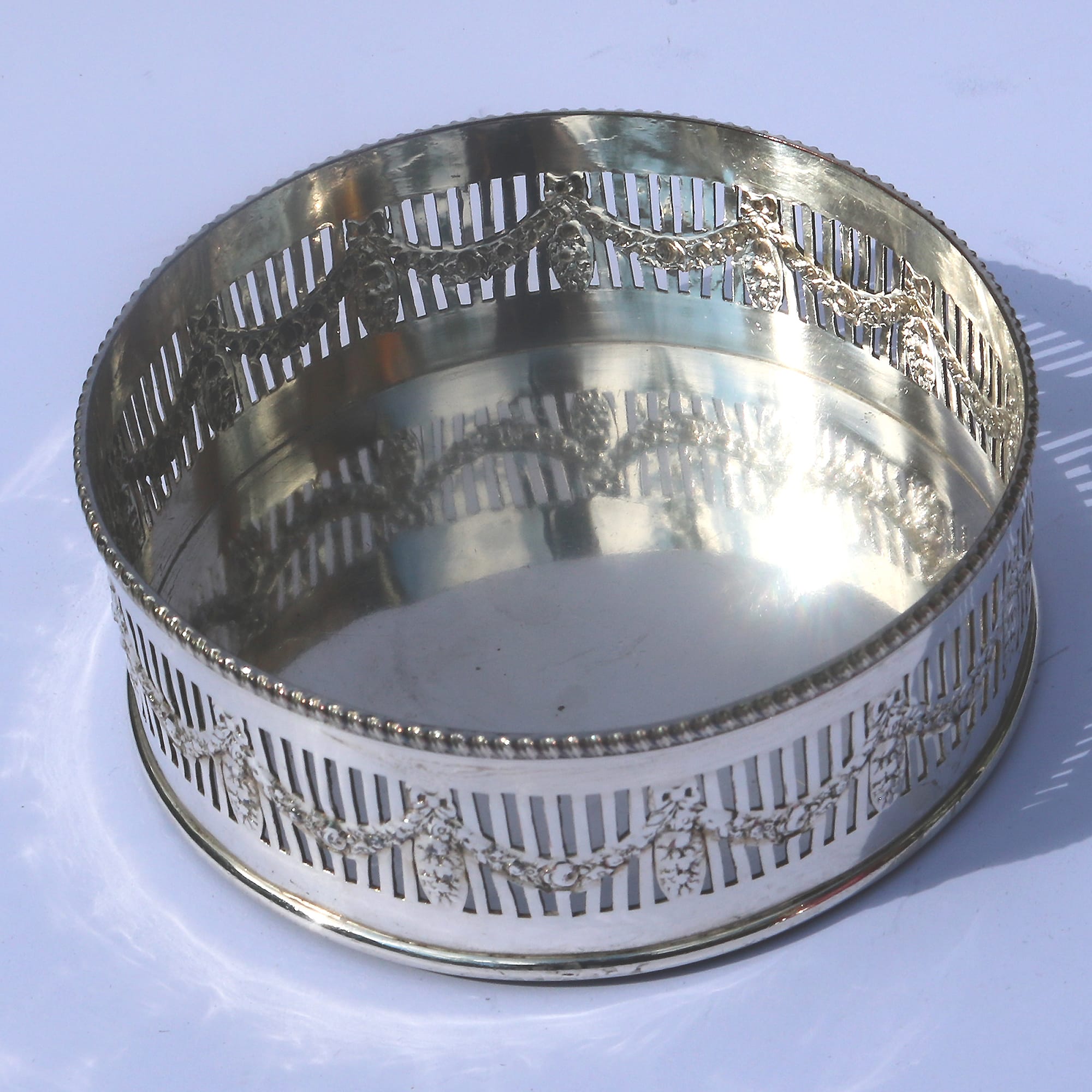 An antique silver plated on copper pierced Decanter Stand Coaster C.1900