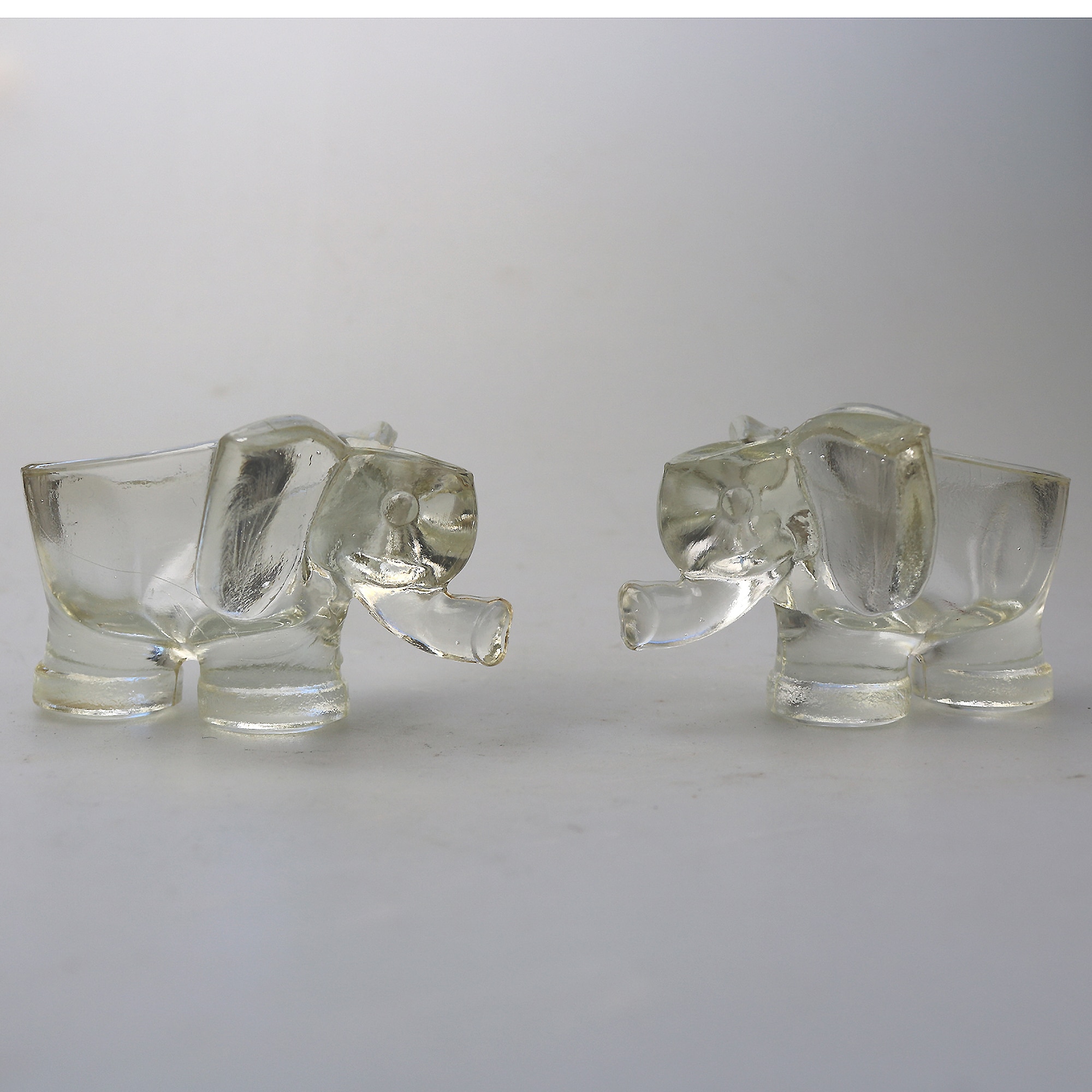 An unusual pair of Art Deco novelty elephant pressed glass Salt Cellars C.1920's