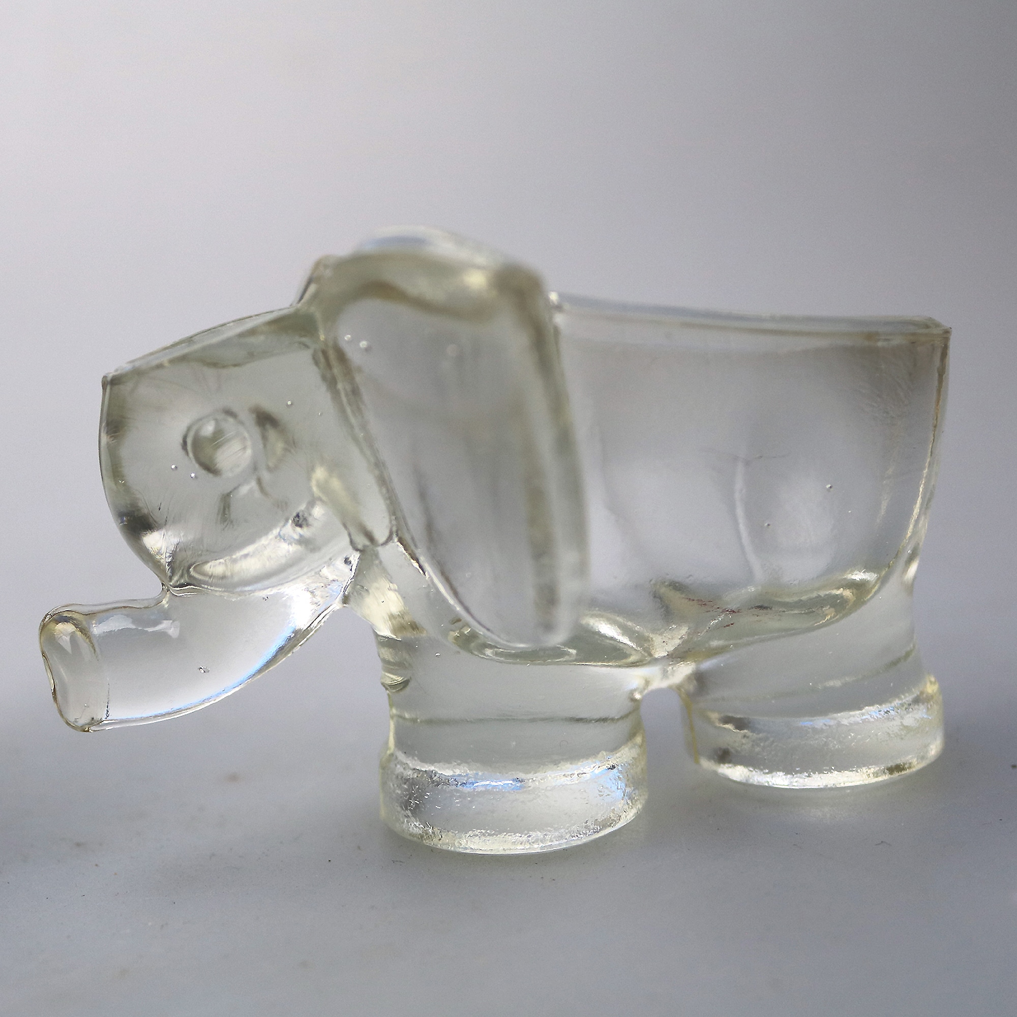 An unusual pair of Art Deco novelty elephant pressed glass Salt Cellars C.1920's