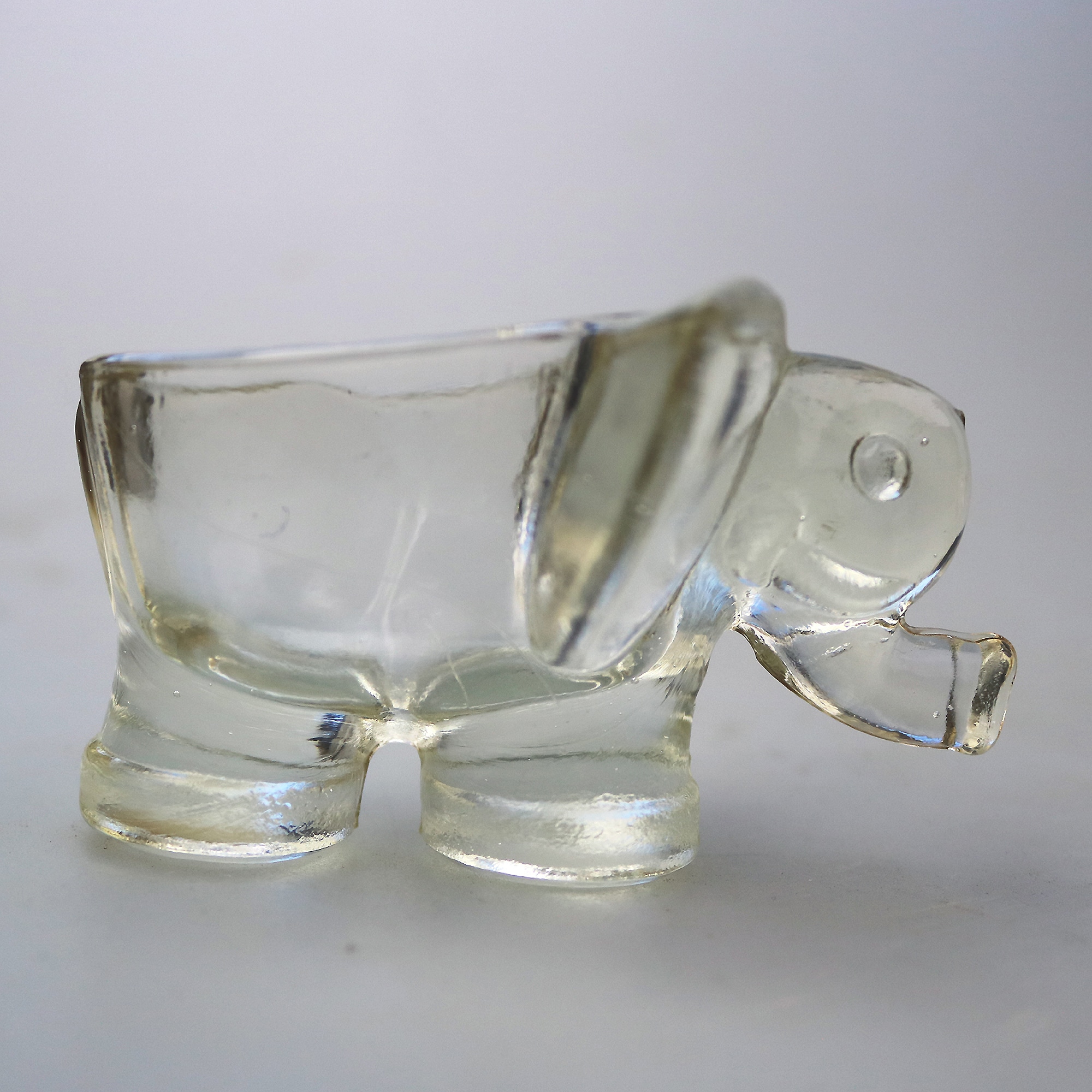 An unusual pair of Art Deco novelty elephant pressed glass Salt Cellars C.1920's