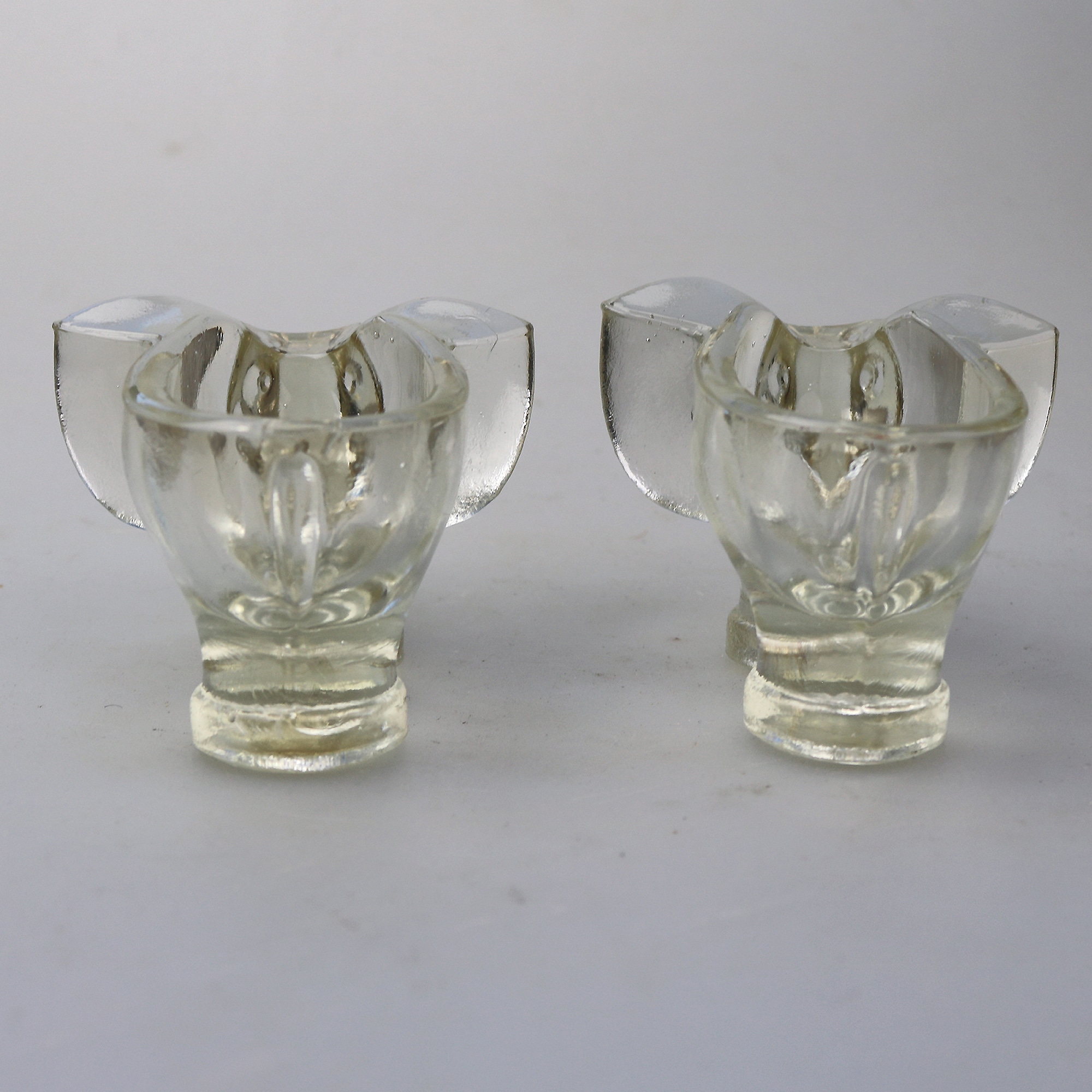 An unusual pair of Art Deco novelty elephant pressed glass Salt Cellars C.1920's