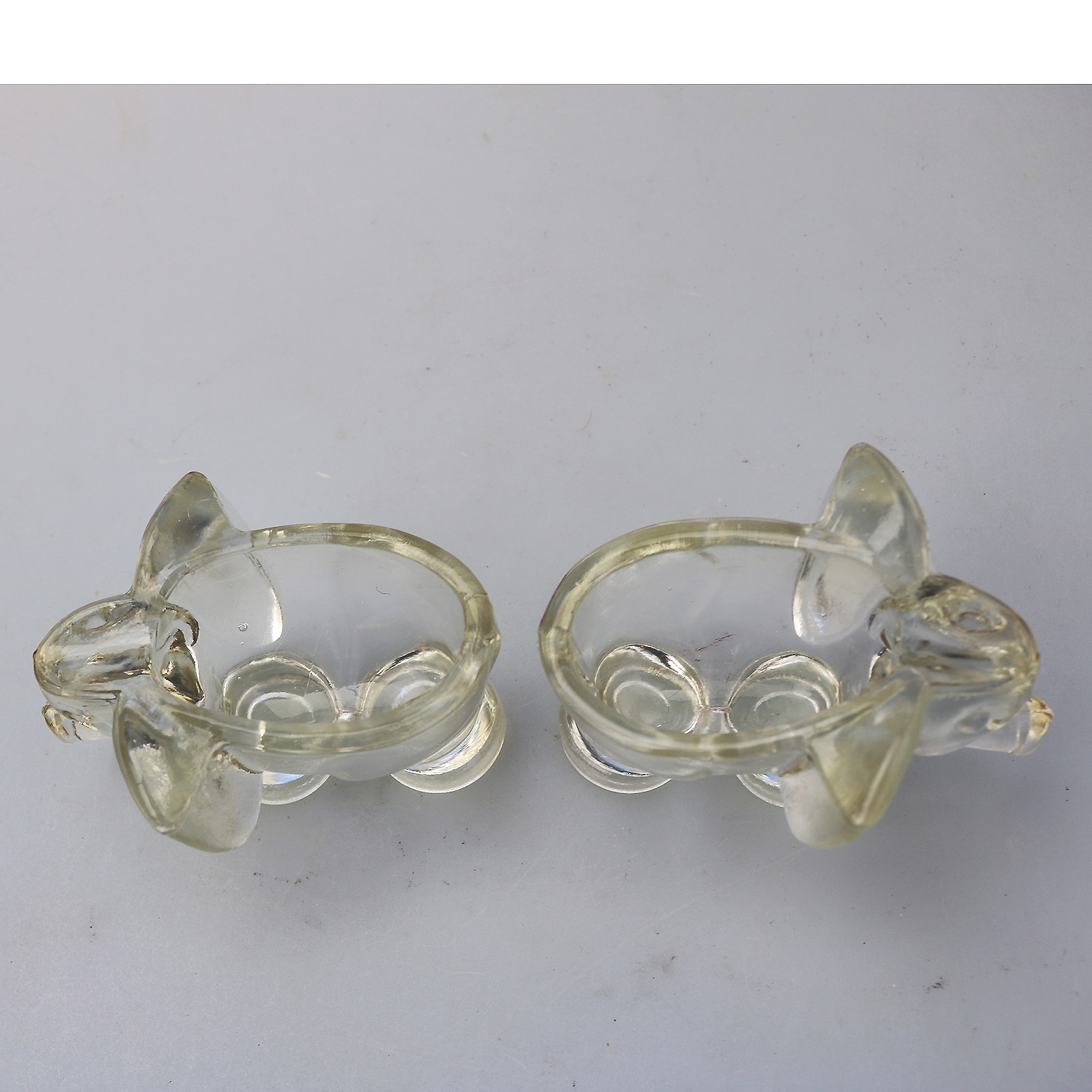 An unusual pair of Art Deco novelty elephant pressed glass Salt Cellars C.1920's