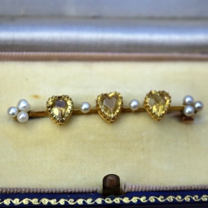 A very fine antique 15ct gold bar brooch set 3X heart cut citrine or yellow topaz C.1900