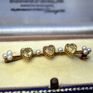 A very fine antique 15ct gold bar brooch set 3X heart cut citrine or yellow topaz C.1900