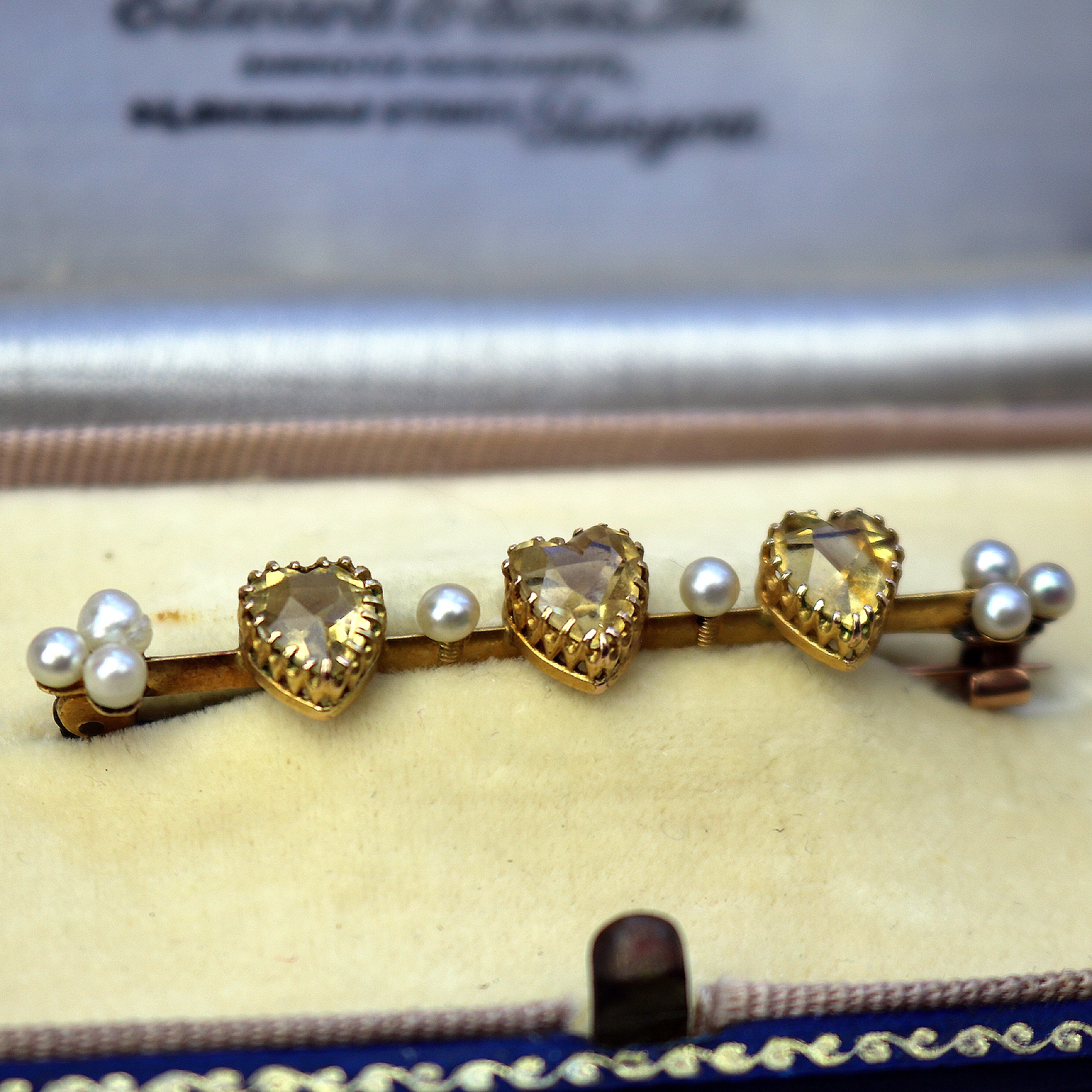 A very fine antique 15ct gold bar brooch set 3X heart cut citrine or yellow topaz C.1900