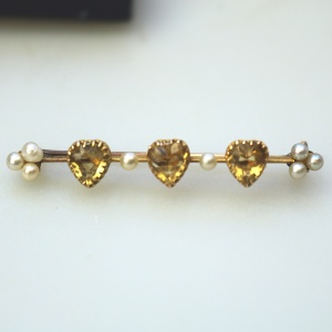 A very fine antique 15ct gold bar brooch set 3X heart cut citrine or yellow topaz C.1900