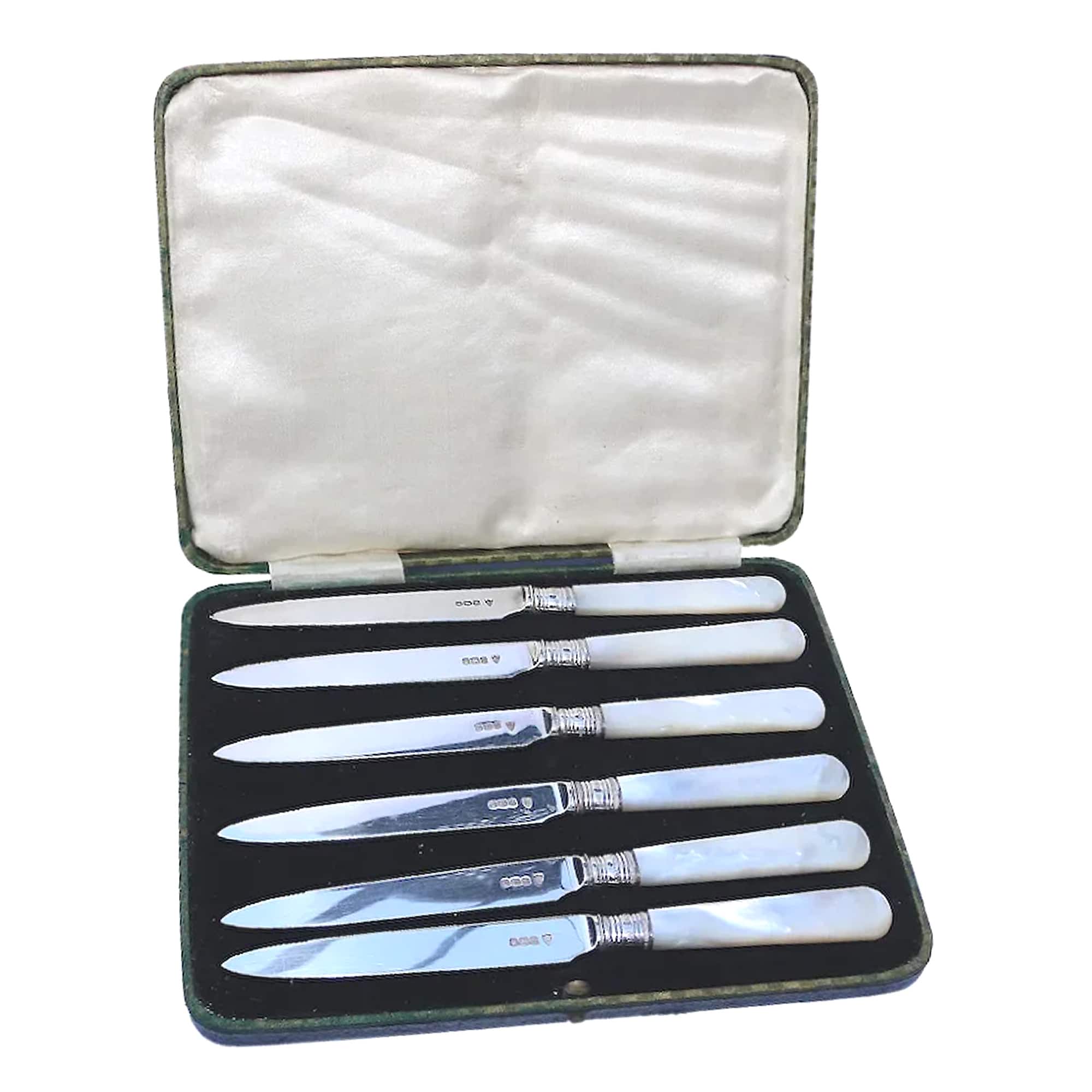 A good cased set of antique 6X English solid silver & mother of pearl table knives C.1930