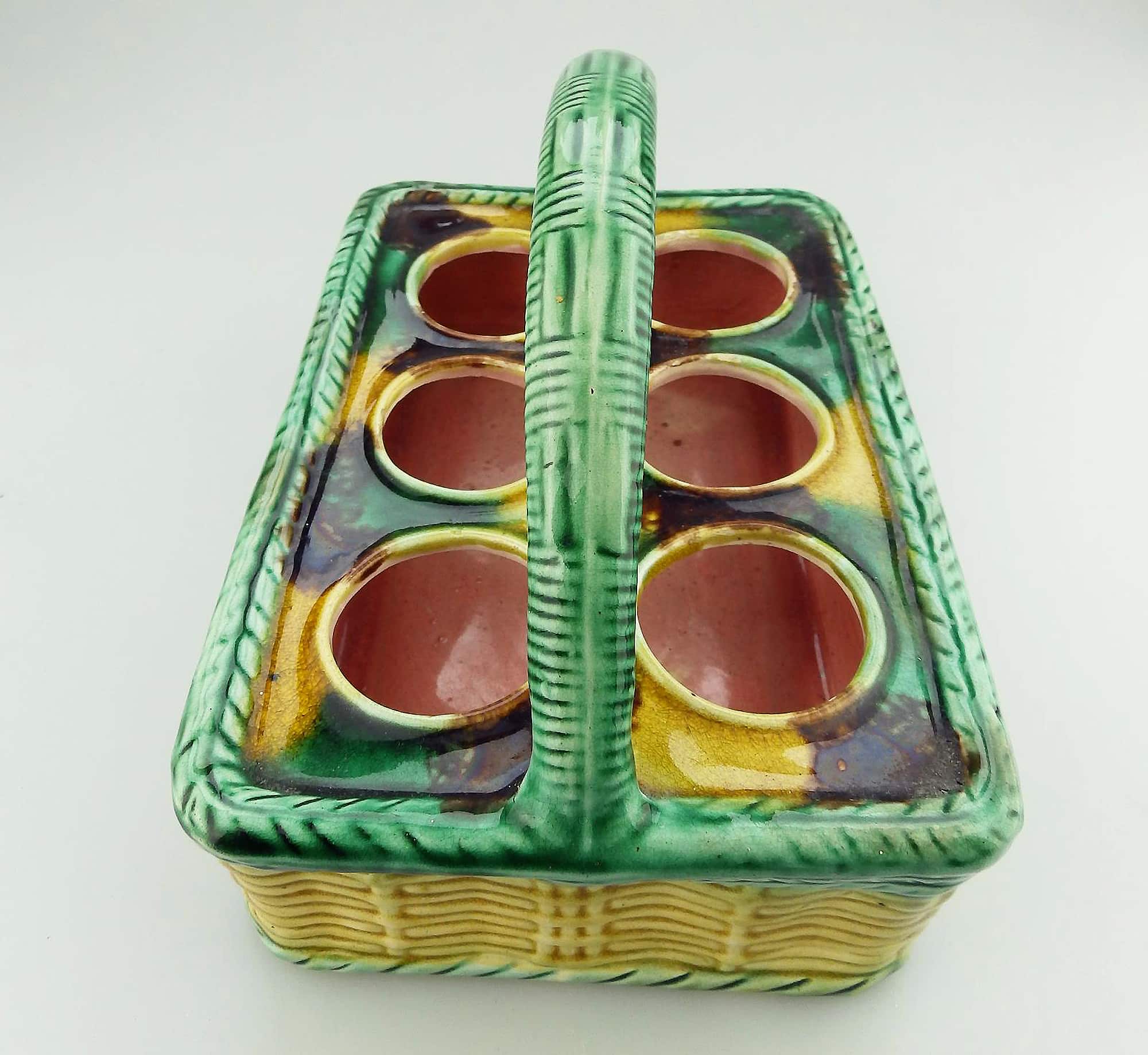 An antique novelty tortoiseshell glaze Majolica pottery Basket Egg Stand C.19thC