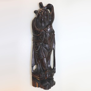 A large antique Chinese silver inlaid hardwood carved Figurine of a Sage C.19thC