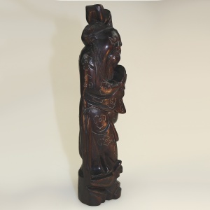 A large antique Chinese silver inlaid hardwood carved Figurine of a Sage C.19thC