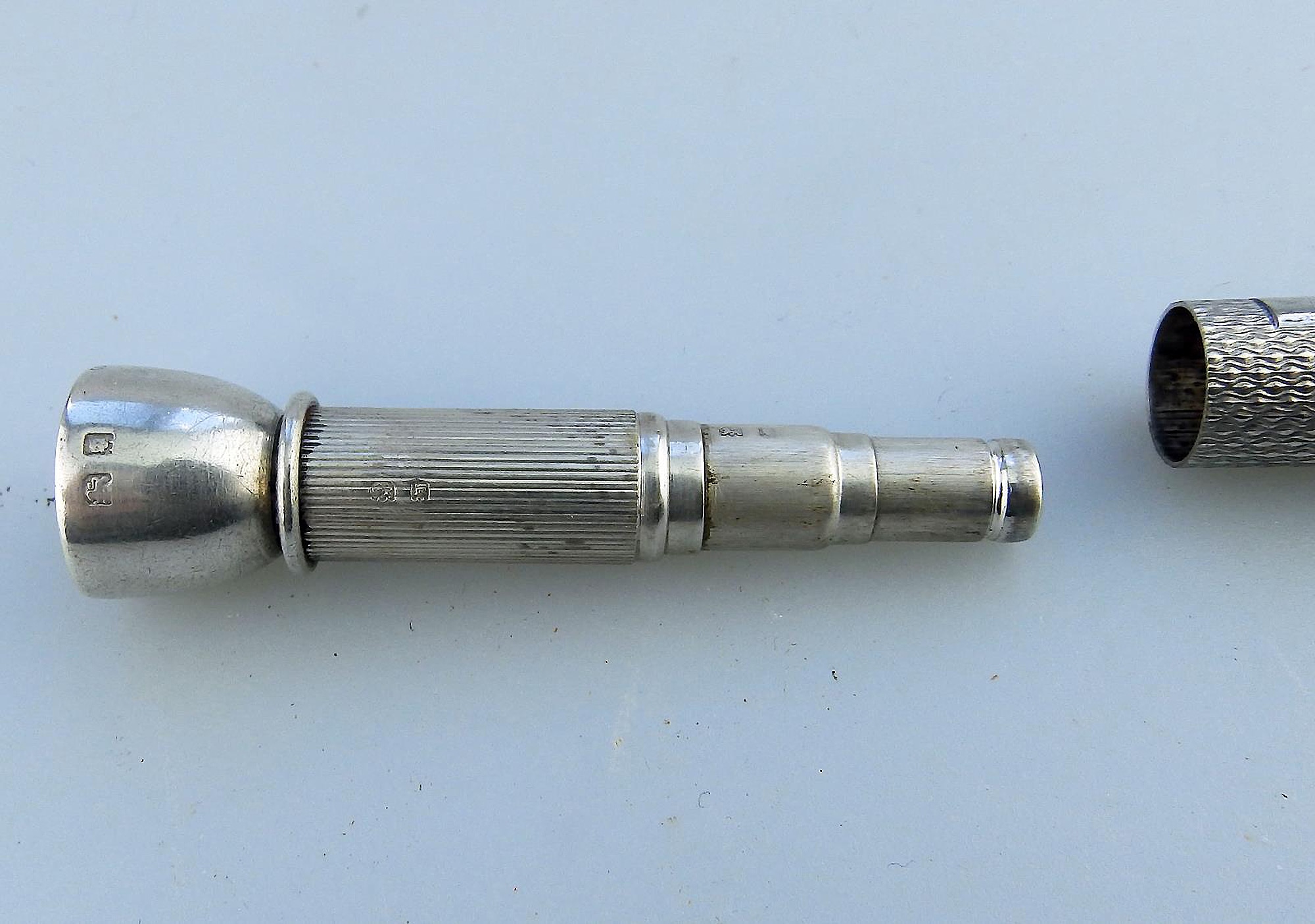 An antique English solid silver Sampson Mordan & Goldsmiths Cigar Piercer C.1933