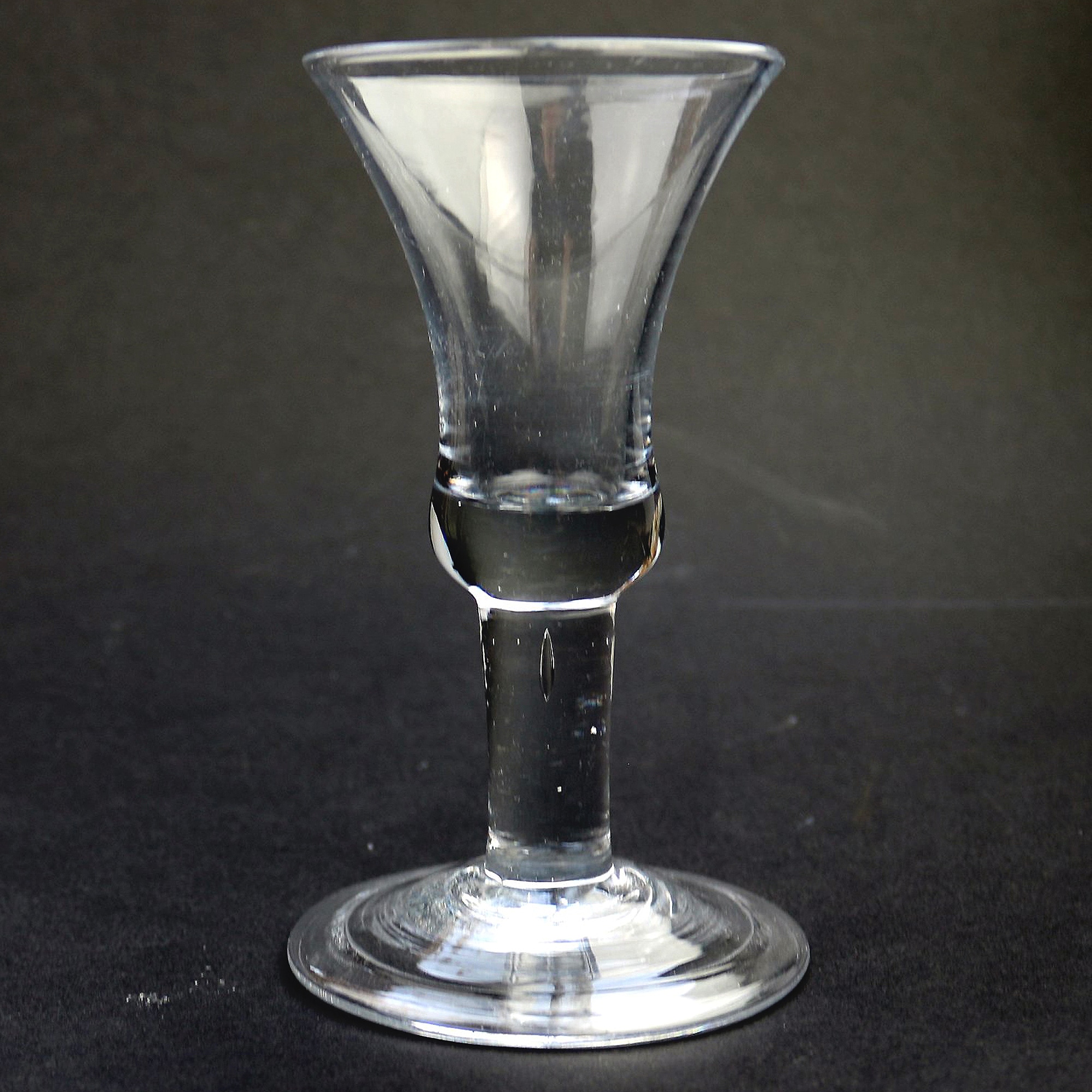 An antique Georgian folded foot & plain short tear drop stem Wine Glass C.18thC