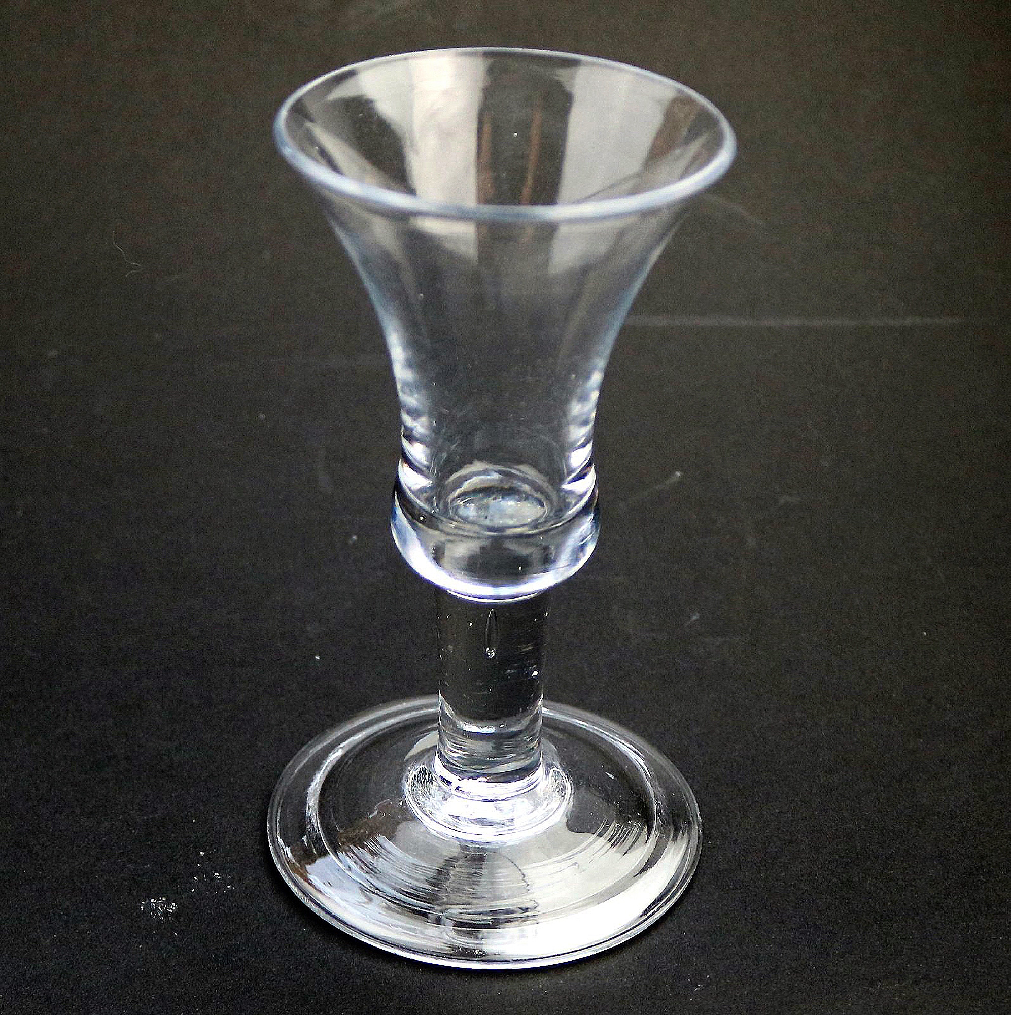 An antique Georgian folded foot & plain short tear drop stem Wine Glass C.18thC