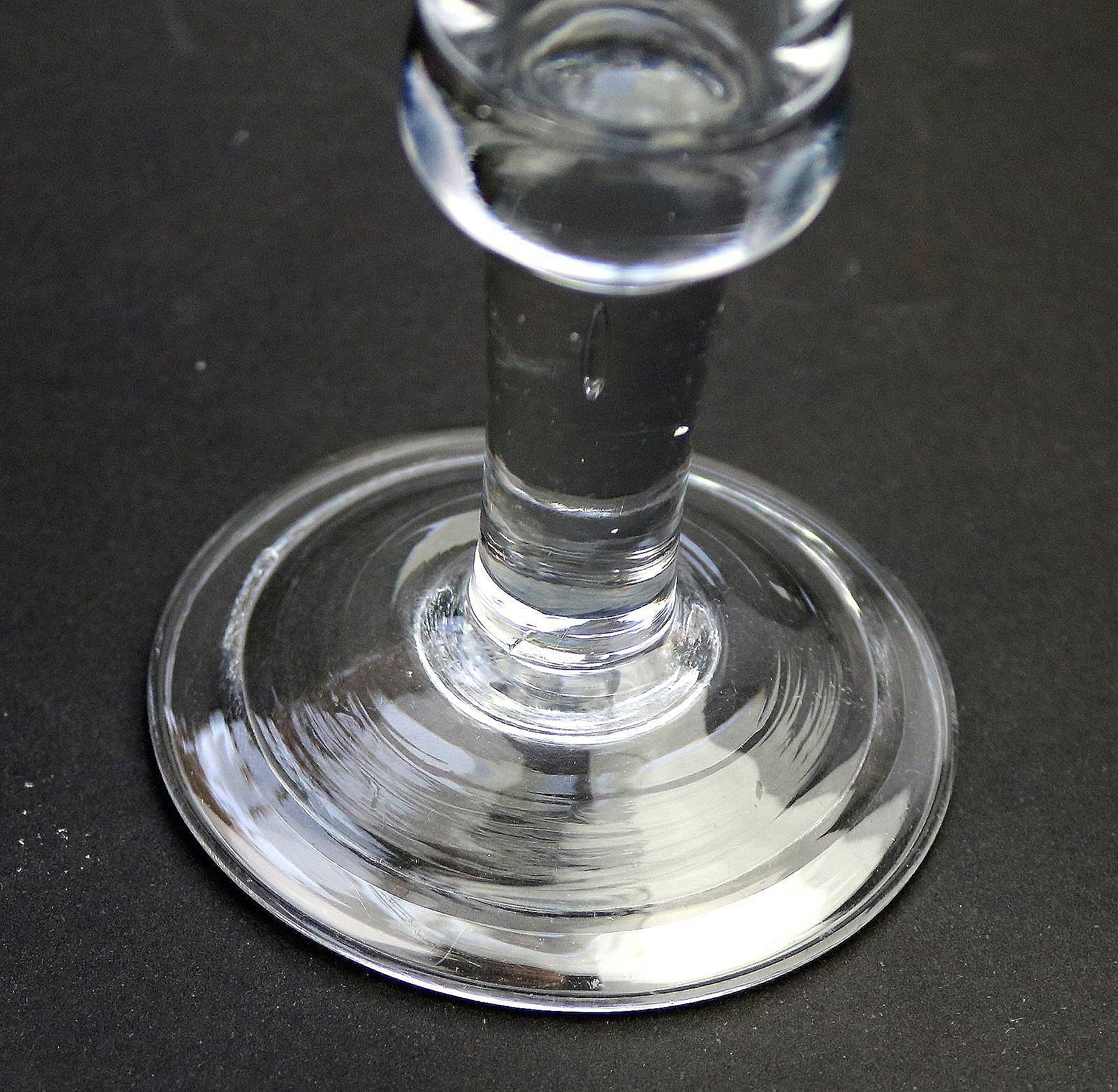 An antique Georgian folded foot & plain short tear drop stem Wine Glass C.18thC