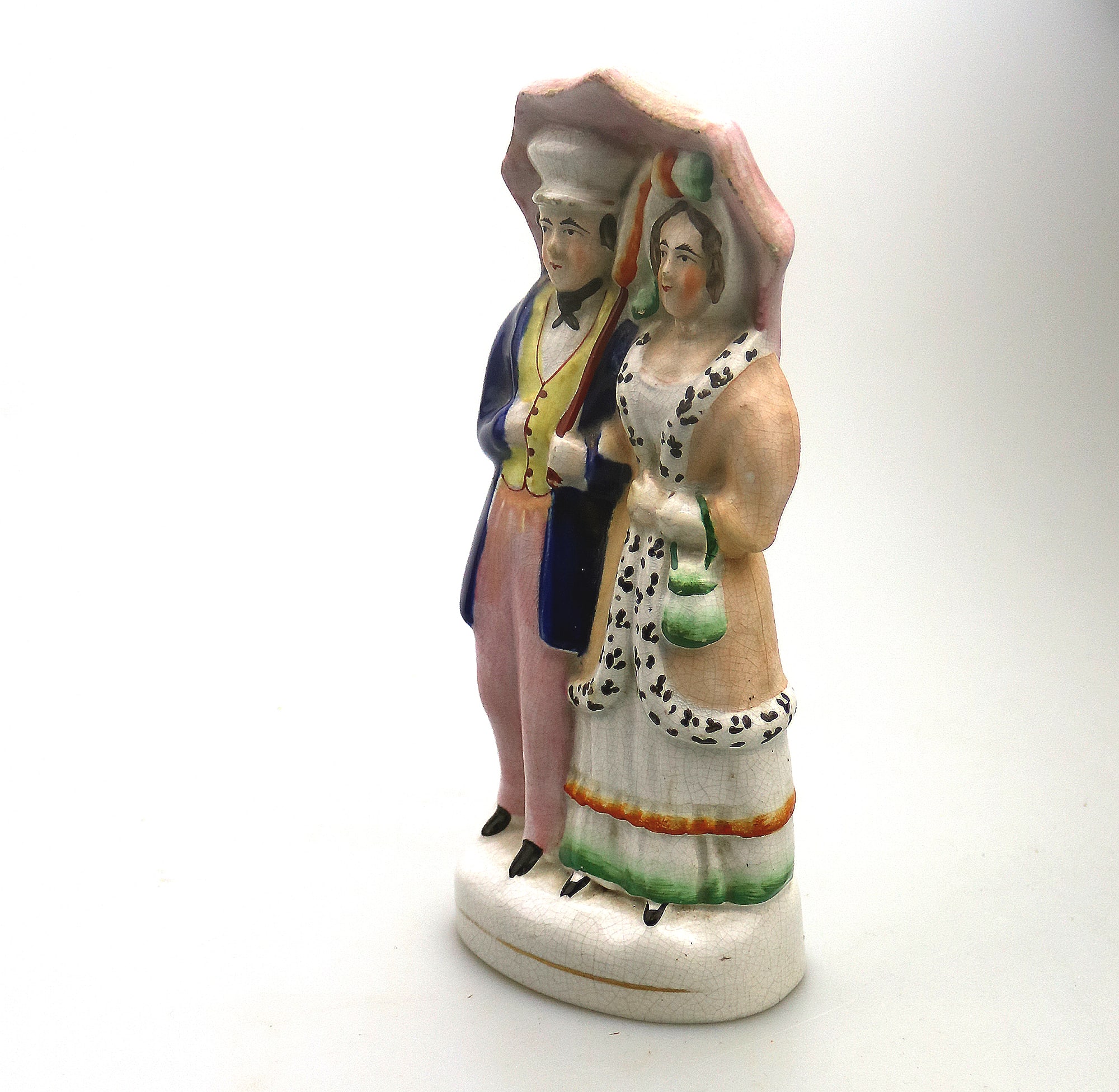 A very charming antique Staffordshire pottery Parasol Couple Figurine C.1850
