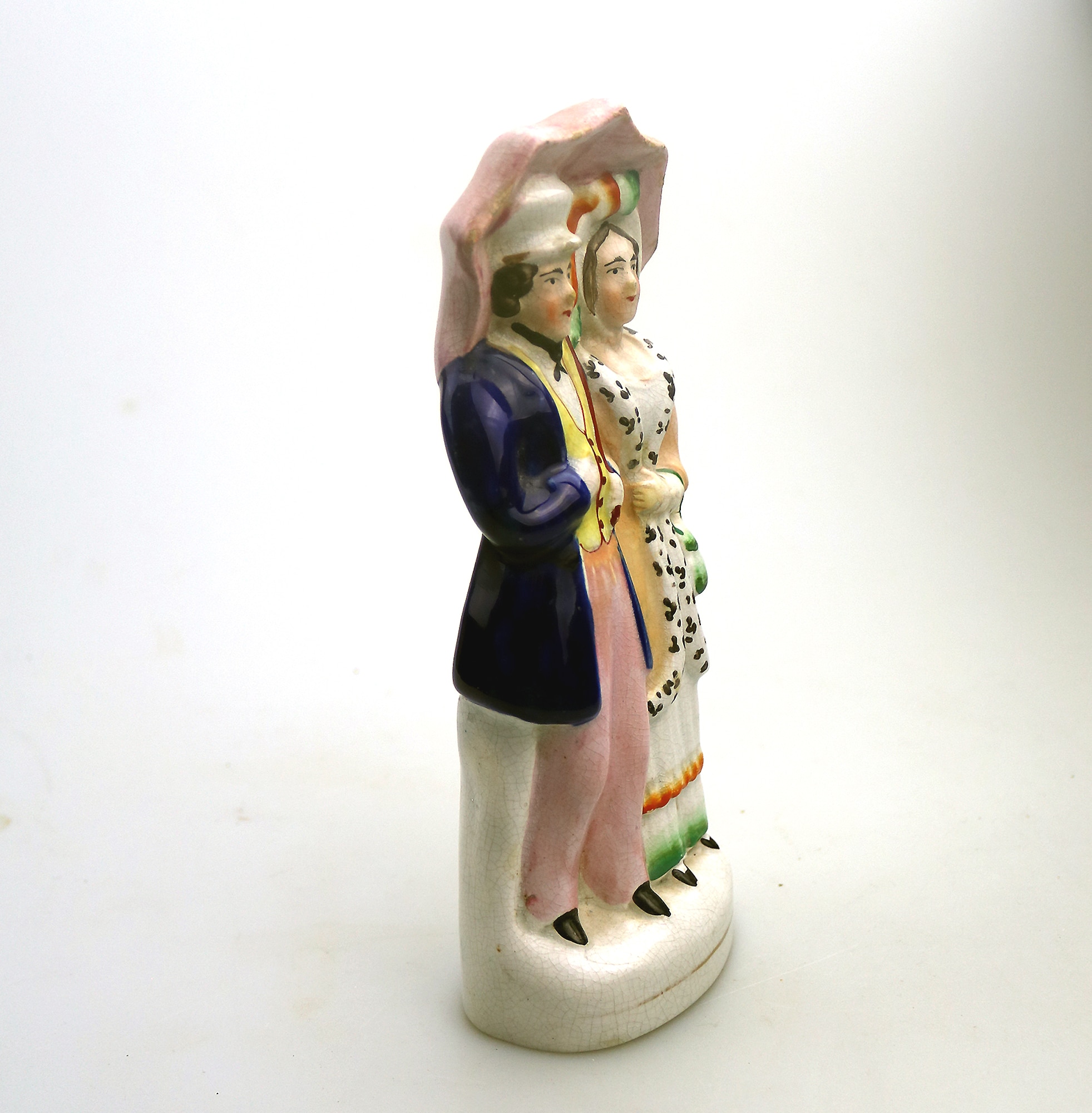 A very charming antique Staffordshire pottery Parasol Couple Figurine C.1850