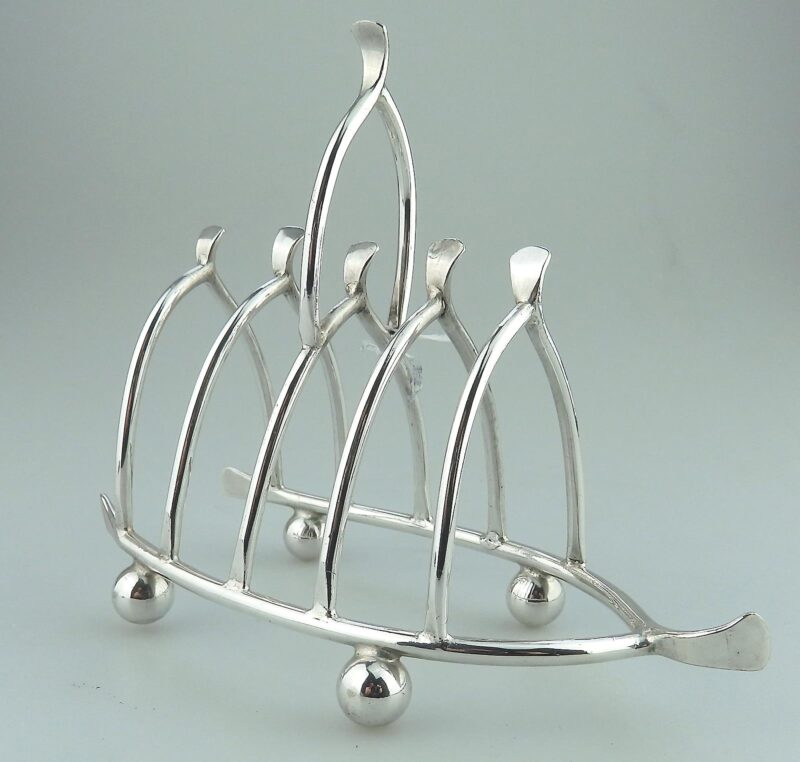 An antique novelty silver plated lucky Chicken Wishbone Toast Rack C.1920