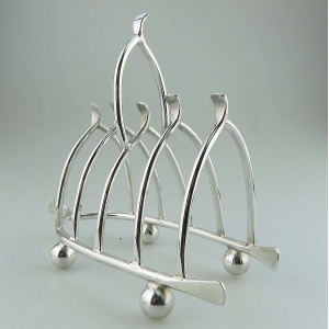 An antique novelty silver plated lucky Chicken Wishbone Toast Rack C.1920