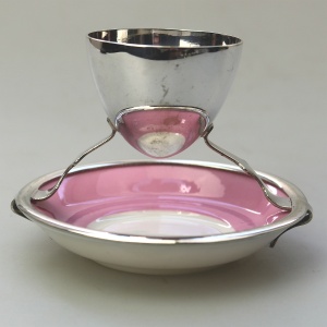 A Christopher Dresser antique novelty Egg Cup & Saucer by Hukin & Heath C.1900's