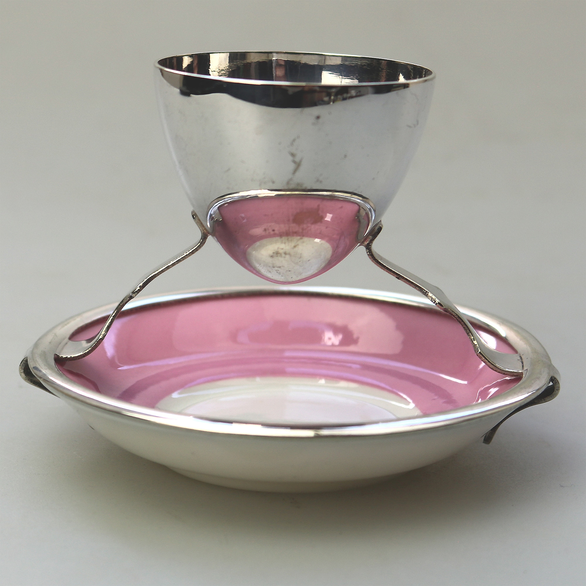 A Christopher Dresser antique novelty Egg Cup & Saucer by Hukin & Heath C.1900's