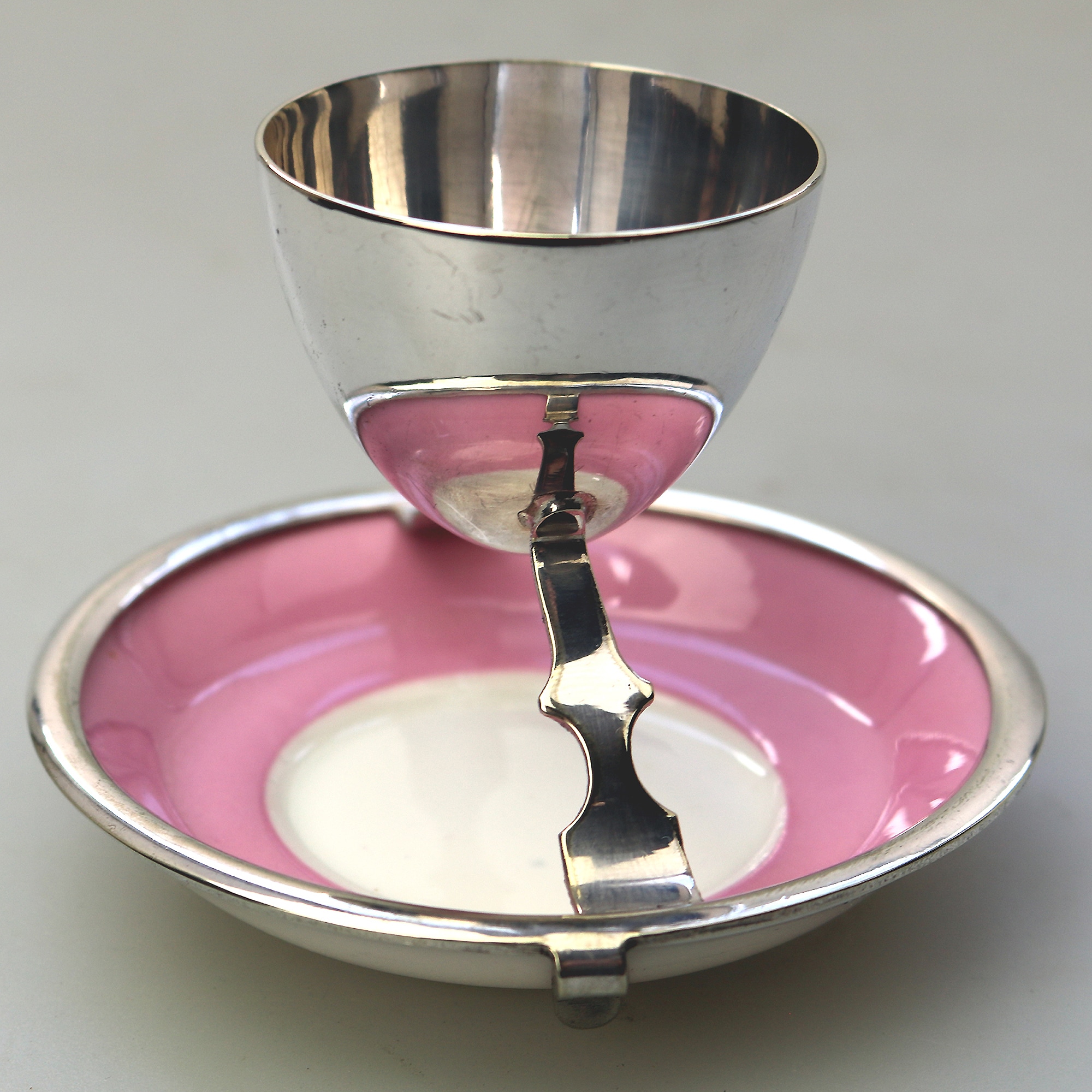 A Christopher Dresser antique novelty Egg Cup & Saucer by Hukin & Heath C.1900's