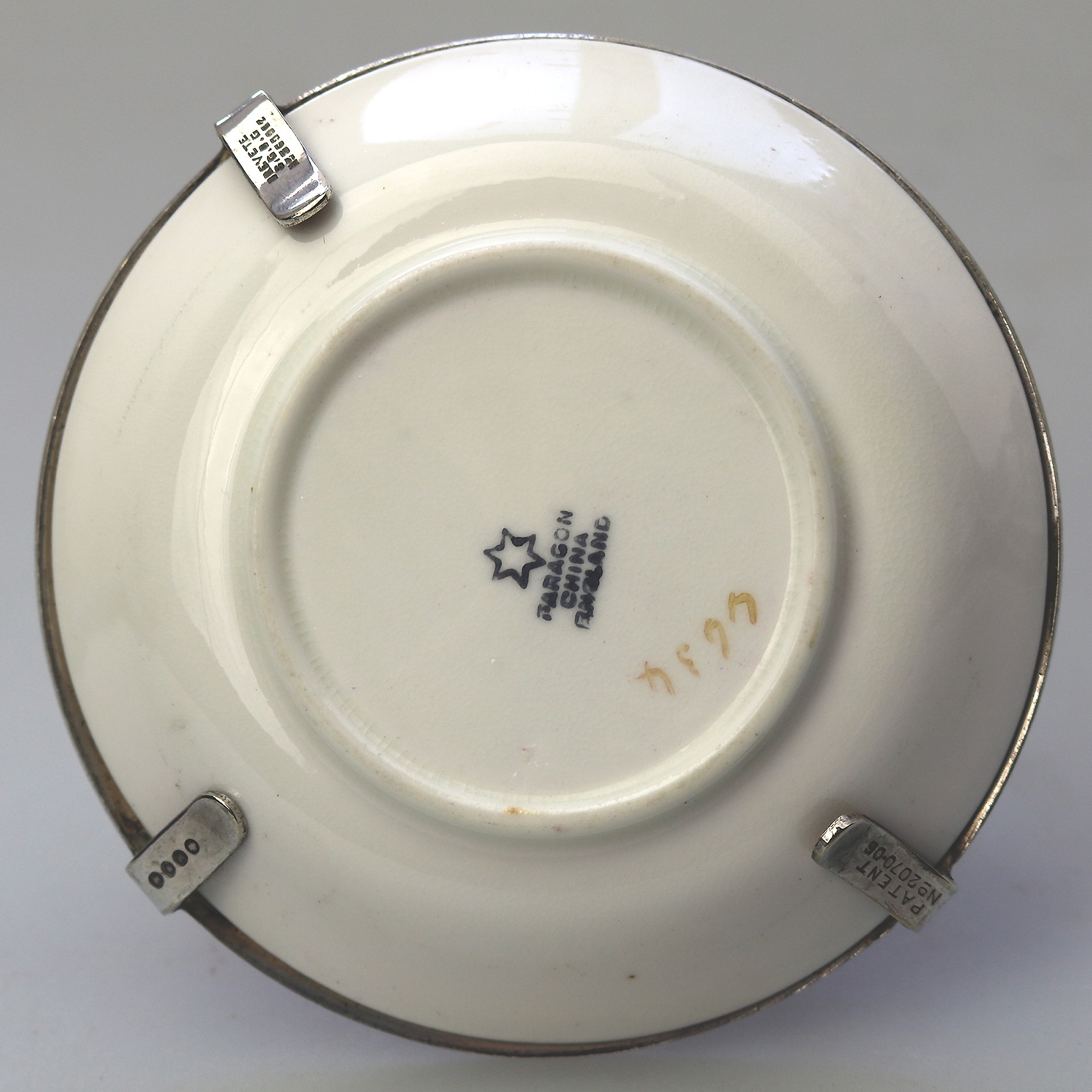 A Christopher Dresser antique novelty Egg Cup & Saucer by Hukin & Heath C.1900's