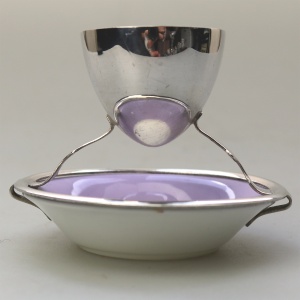 A Christopher Dresser antique novelty Egg Cup & Saucer by Hukin & Heath C.1900's