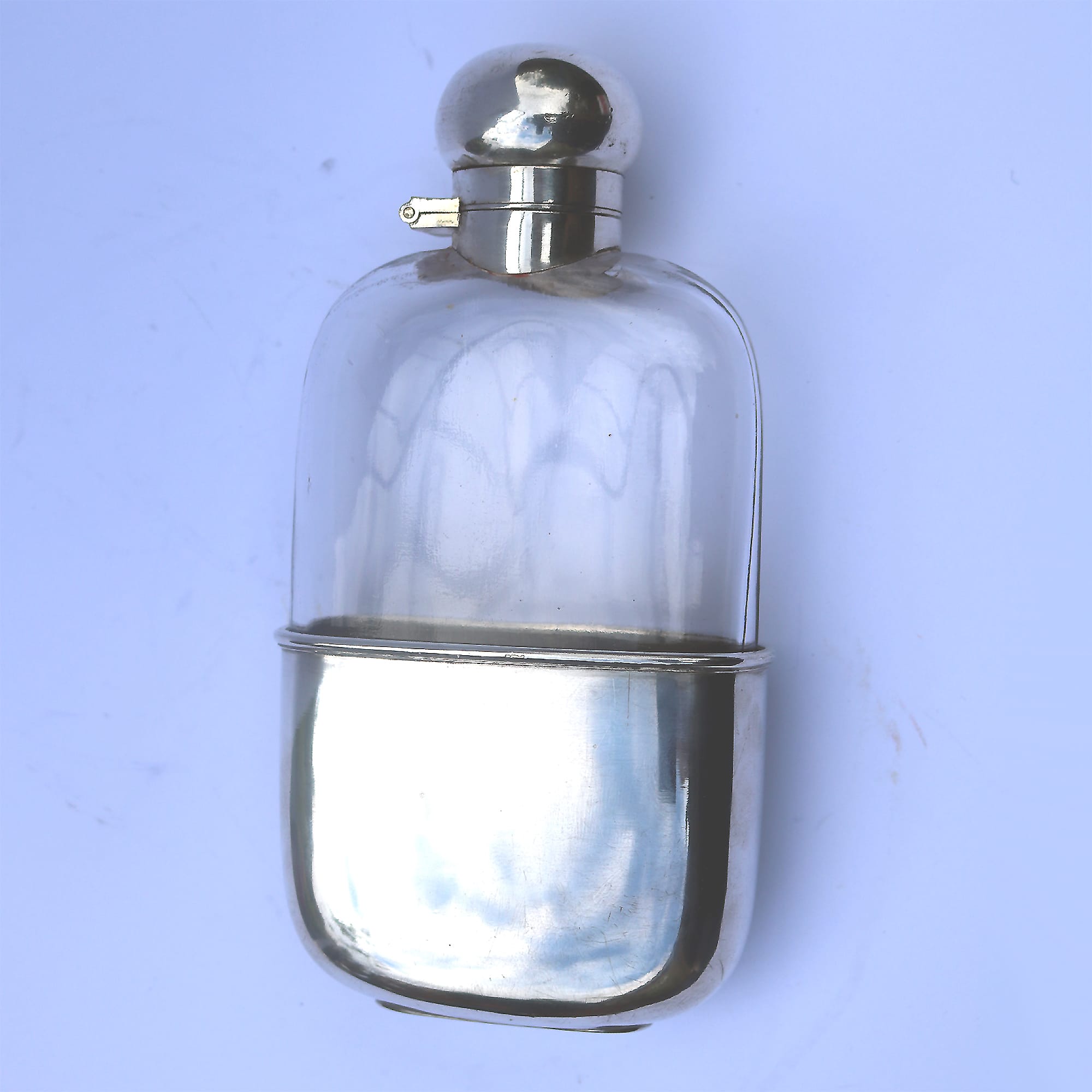 A good and attractive silver plated and glass Hip Flask by Harrods C.20thC