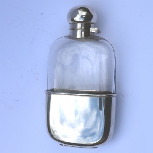 A good and attractive silver plated and glass Hip Flask by Harrods C.20thC
