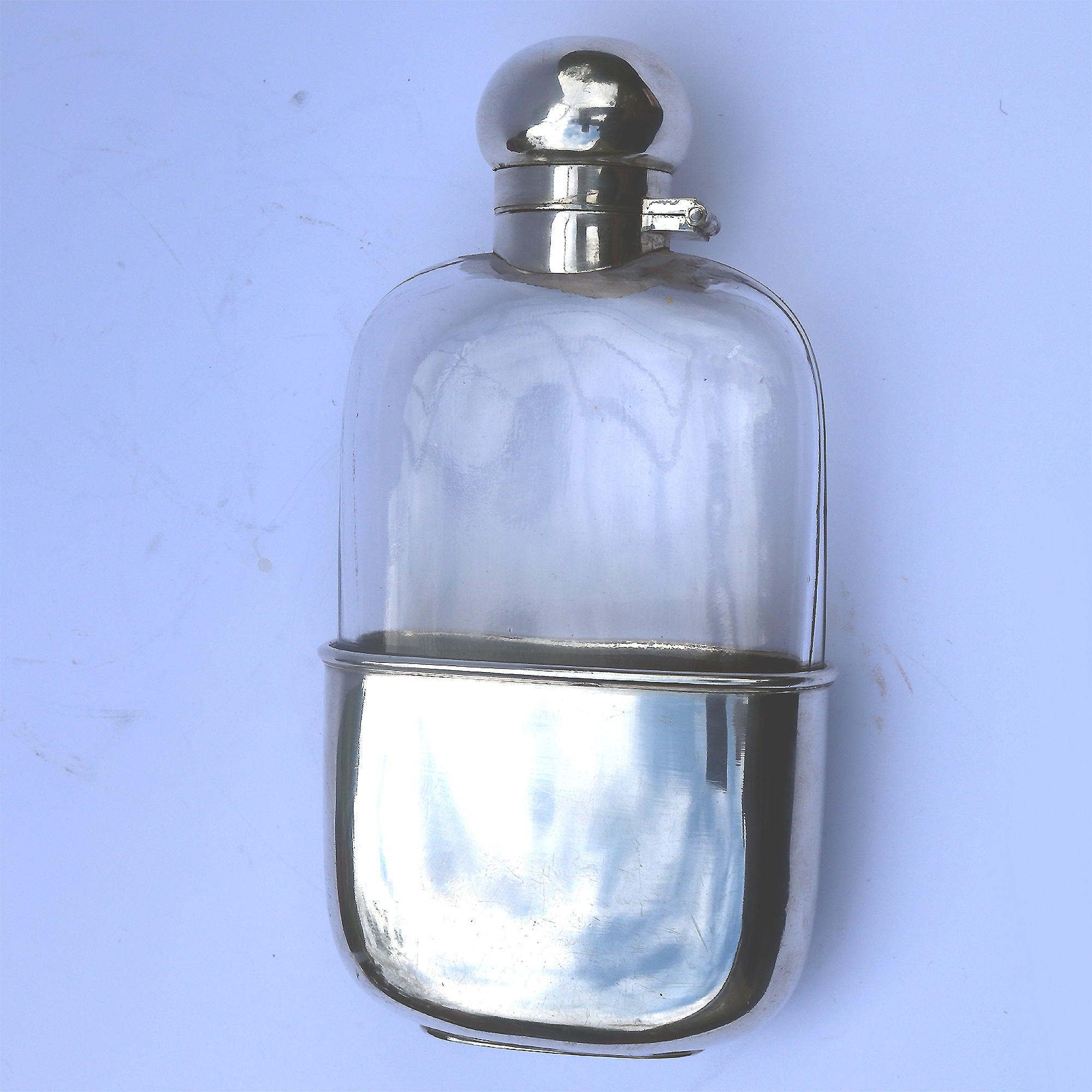 A good and attractive silver plated and glass Hip Flask by Harrods C.20thC